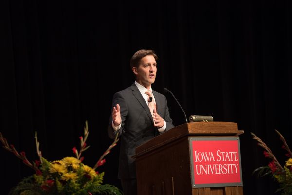 Photo of speaker at a podium.